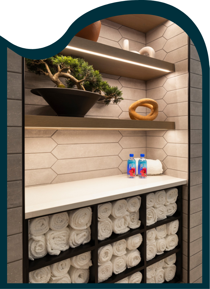 moment apartments lobby with comfortable seating and pretty wallpaper with leaves